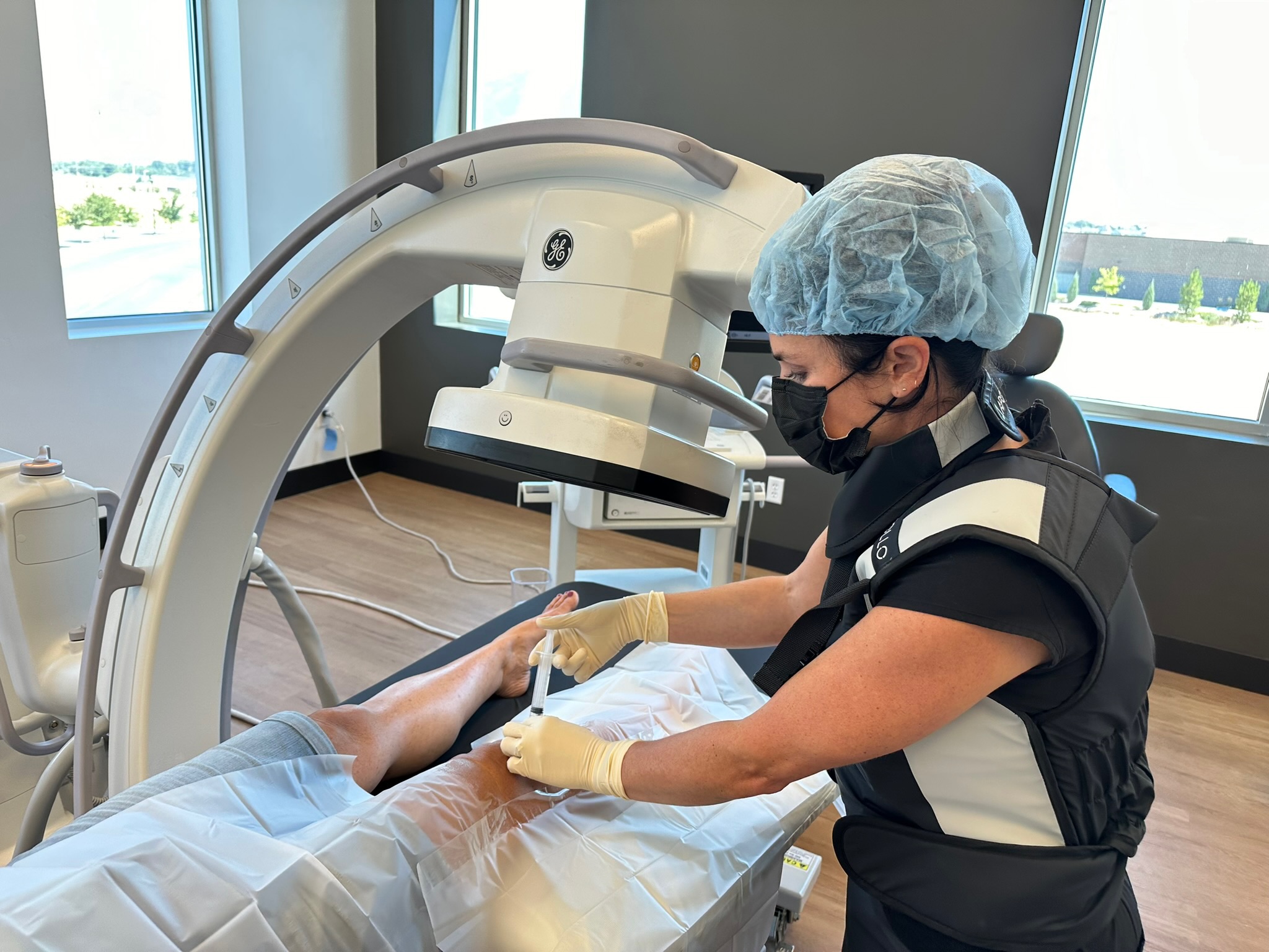 Clinician performing an image-guided injection